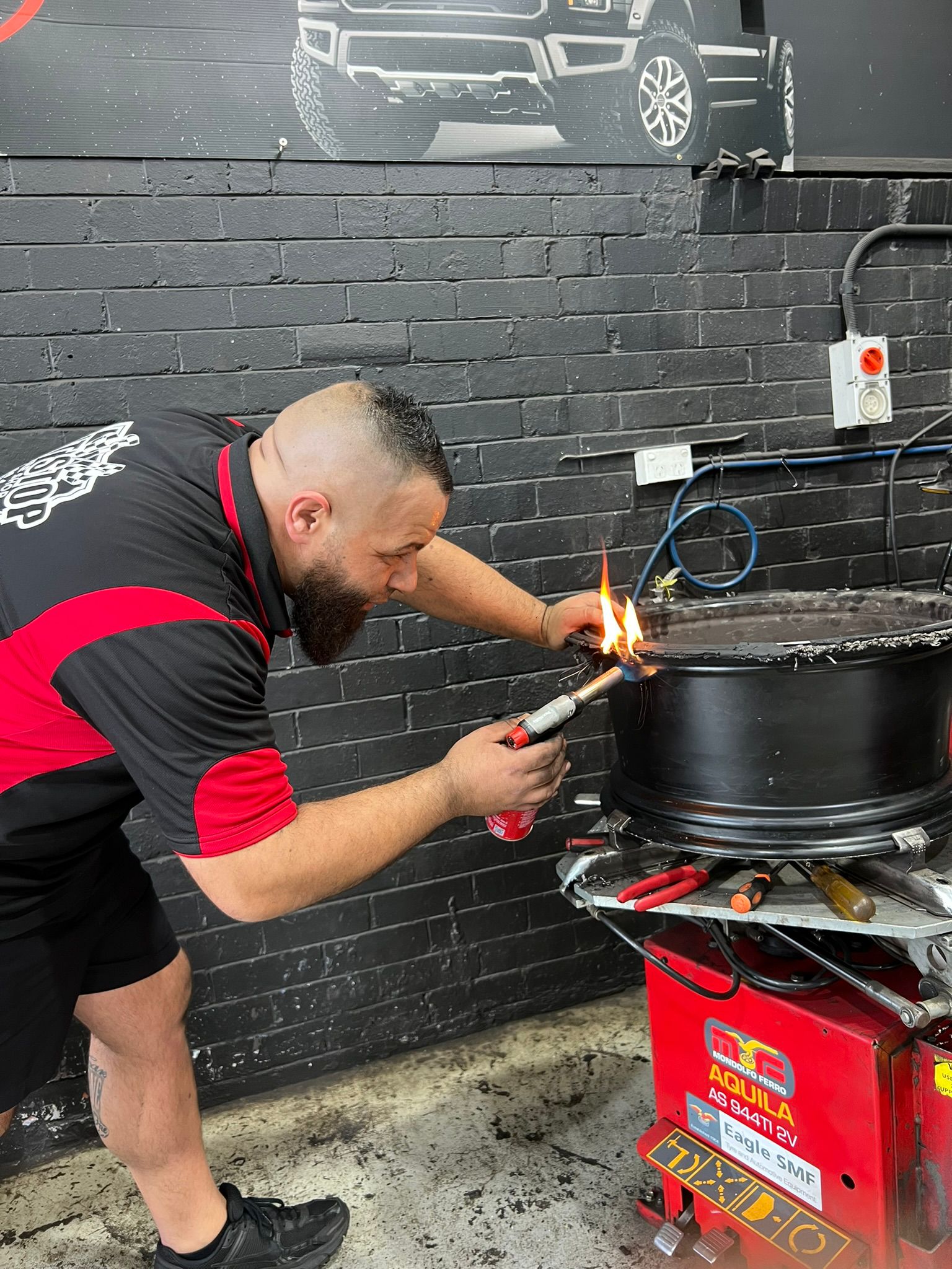 Torch repair work on tyre
