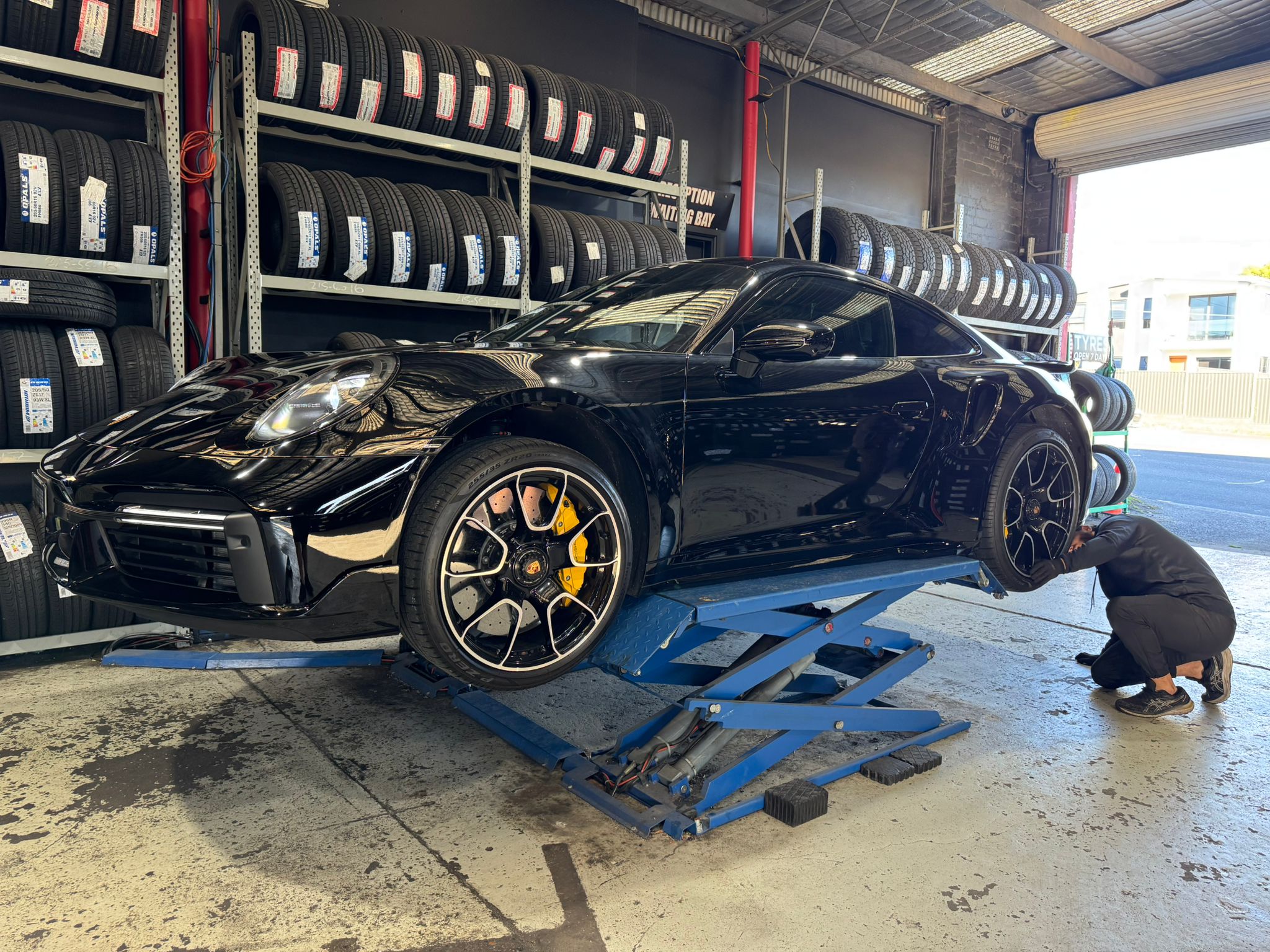 Porsche 911 on workshop lift